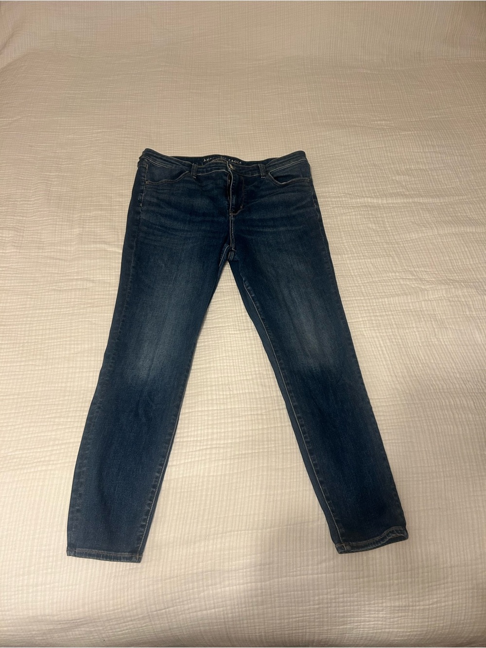 Medium Wash American Eagle Next Level Stretch 360 Skinny Jeans